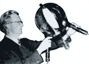 Photo: Baird holding his 
       huge, two-color Telechrome tube